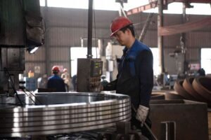 Factory production workers assembling gear reducers.